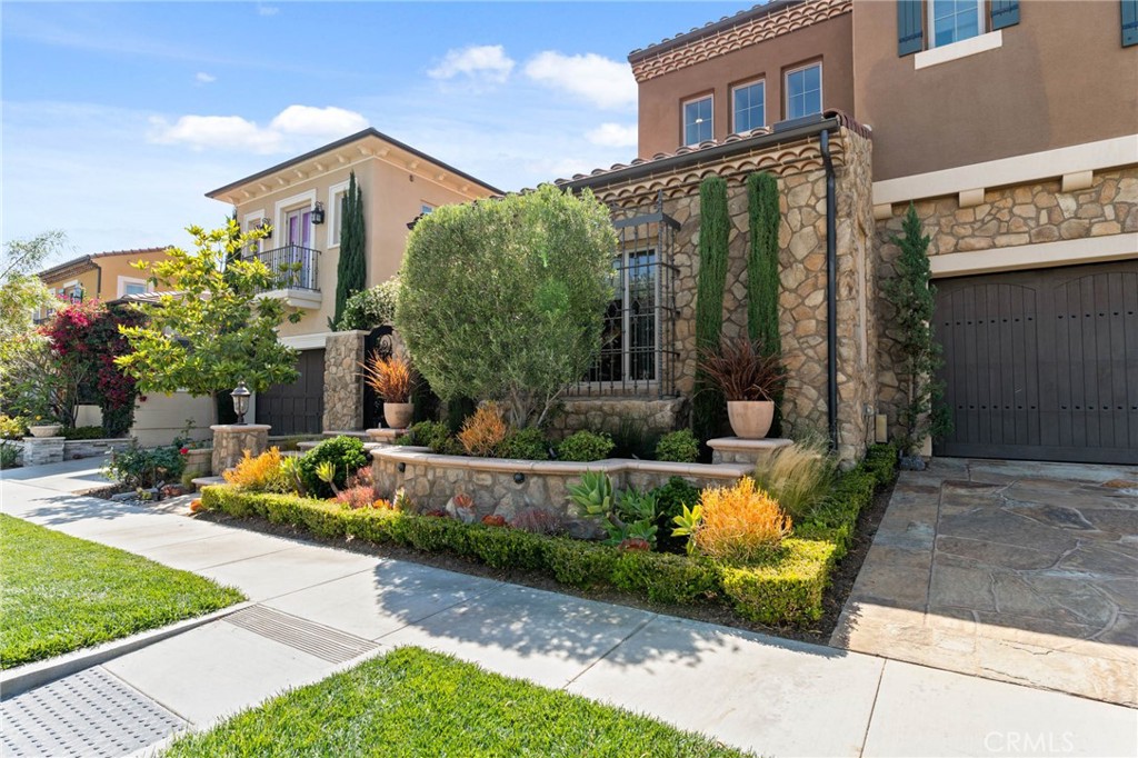 7 Zephyr Irvine, CA 92602 - Photo 6 of 52 a front view of a house with a yard