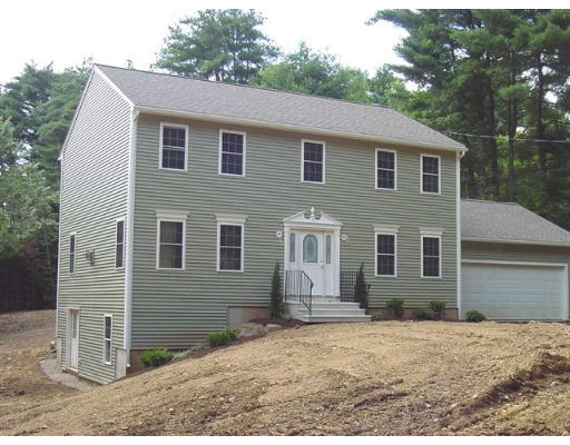 Lot 3 Brookfield Road Sturbridge, MA 01566 - Photo 1 of 1 a front view of a house with a yard