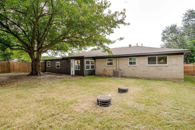 a house with trees in the background