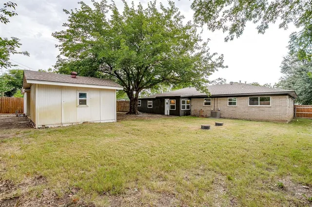 a house view with a backyard space