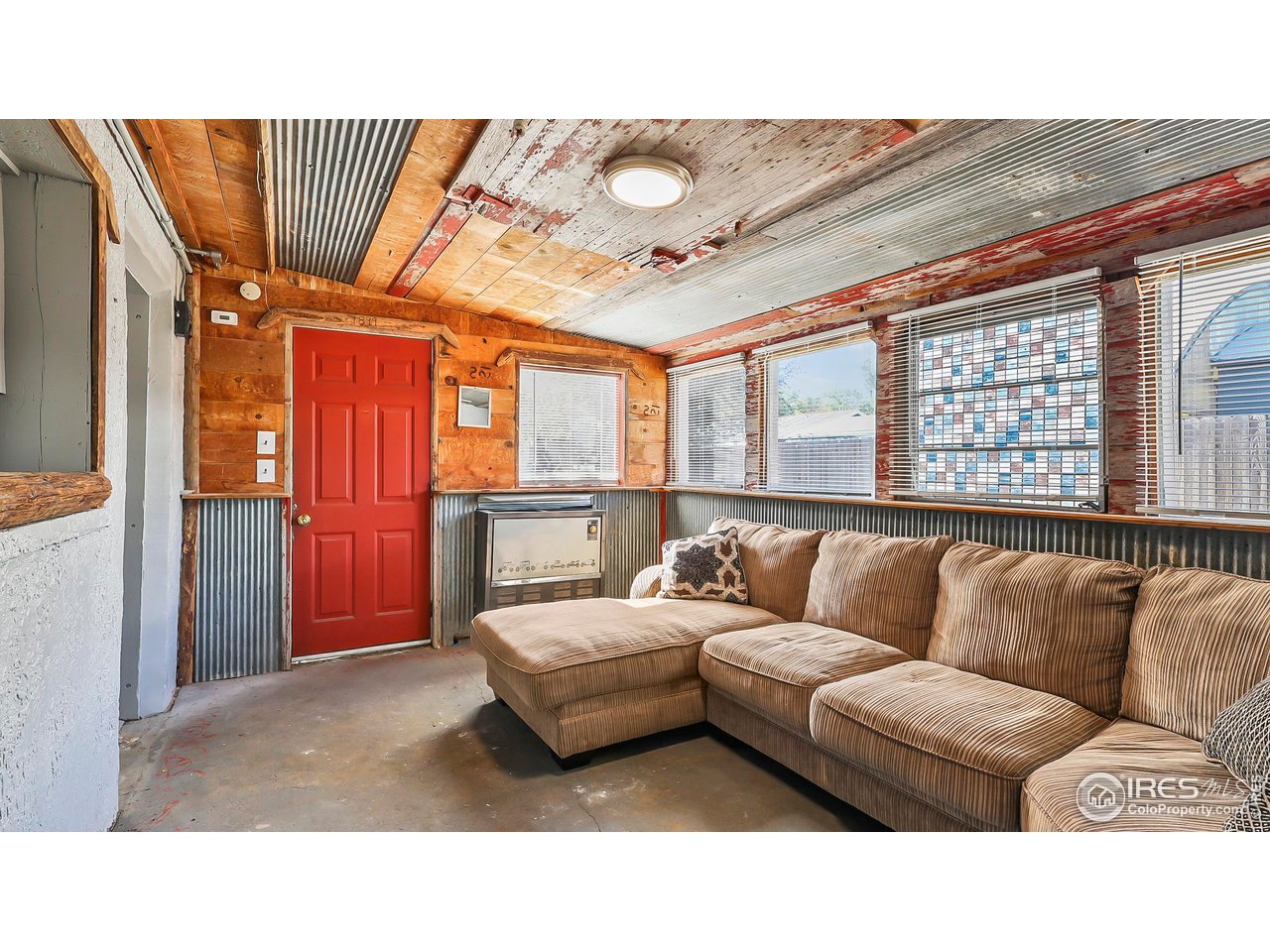 1408 Edison Street Brush, CO 80723 - Photo 11 of 23 a living room with furniture and a large window