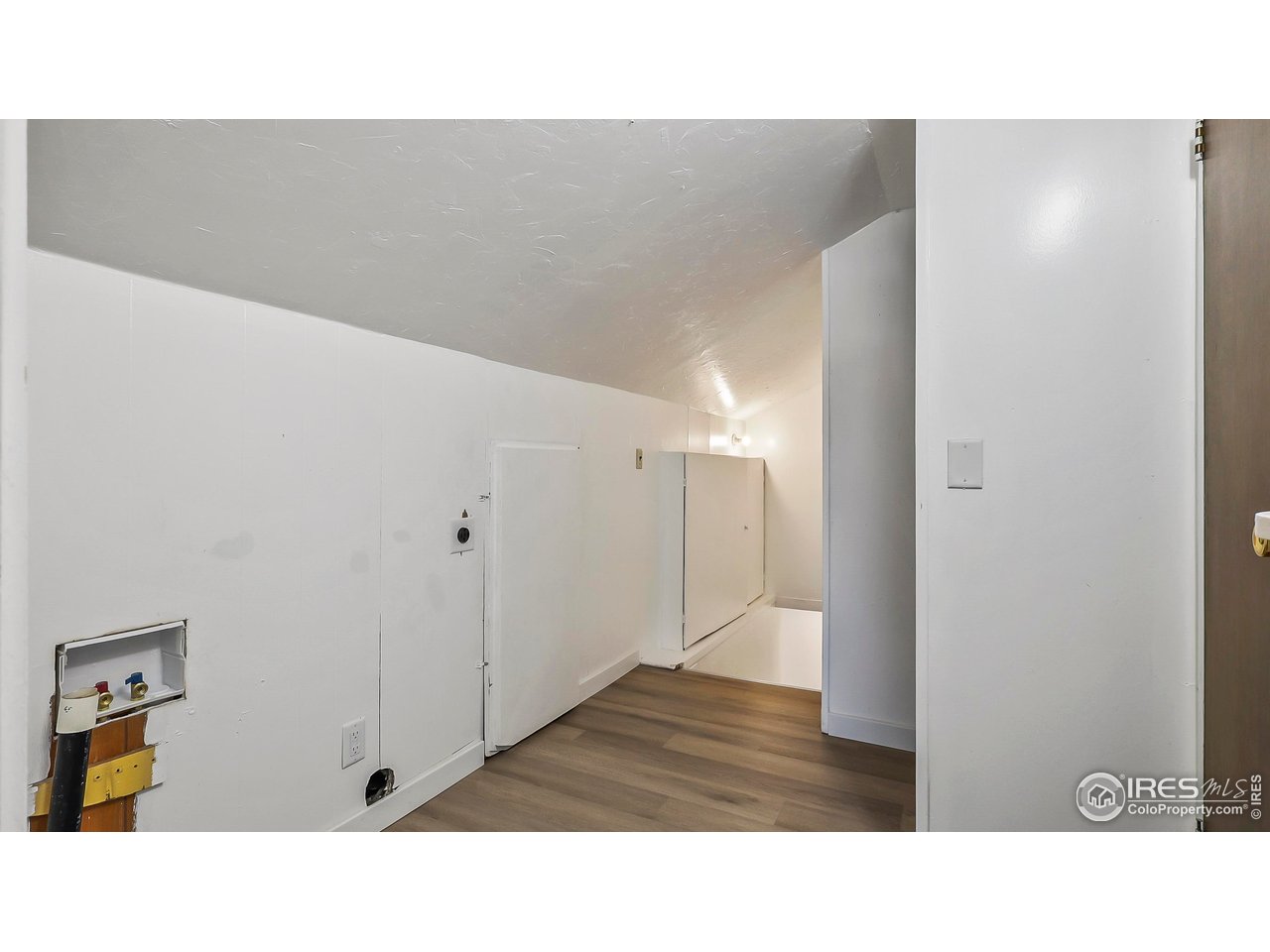 1408 Edison Street Brush, CO 80723 - Photo 22 of 23 a bathroom with a sink and a mirror
