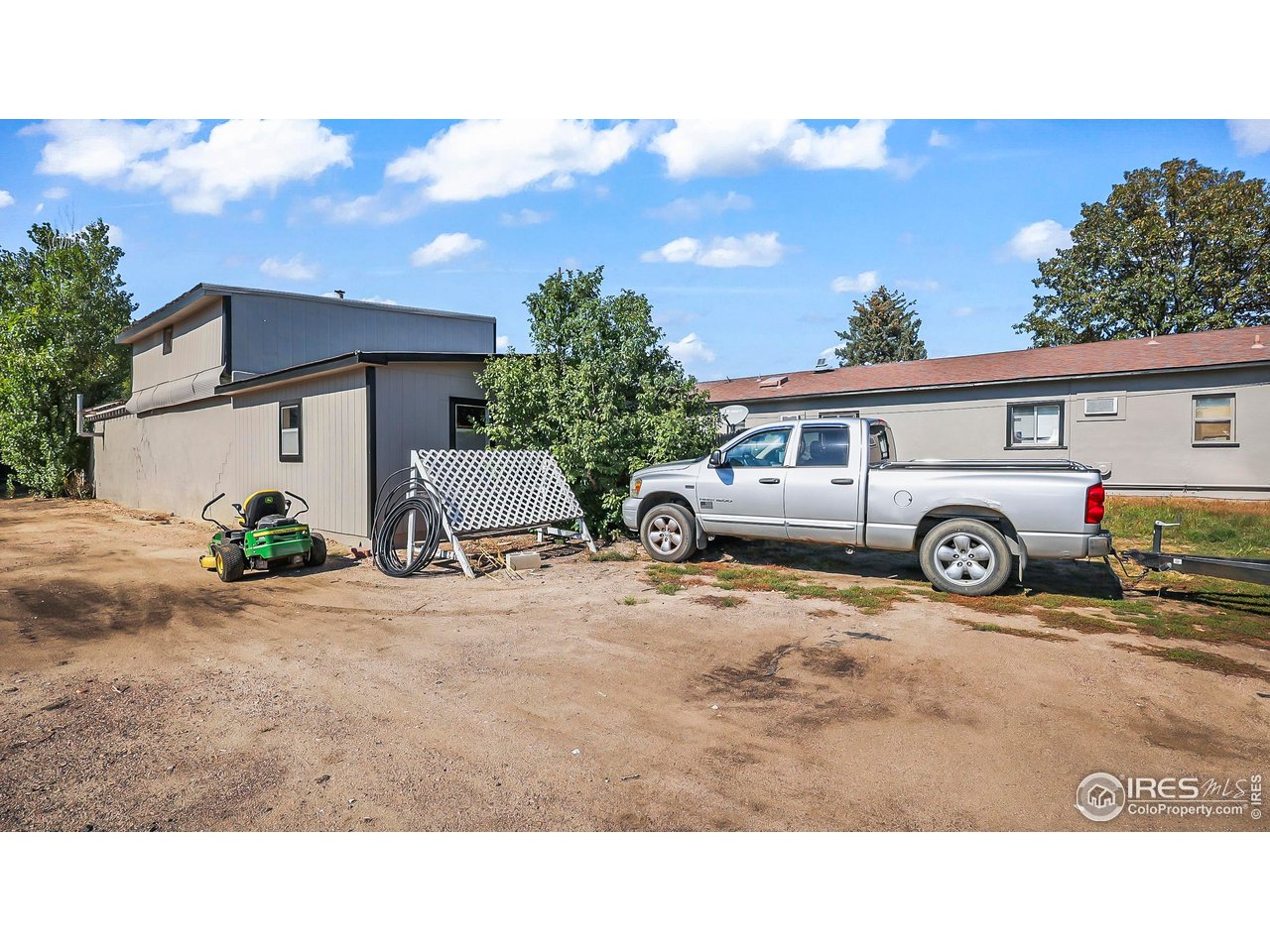 1408 Edison Street Brush, CO 80723 - Photo 7 of 23 a view of a car is parked in front of a house