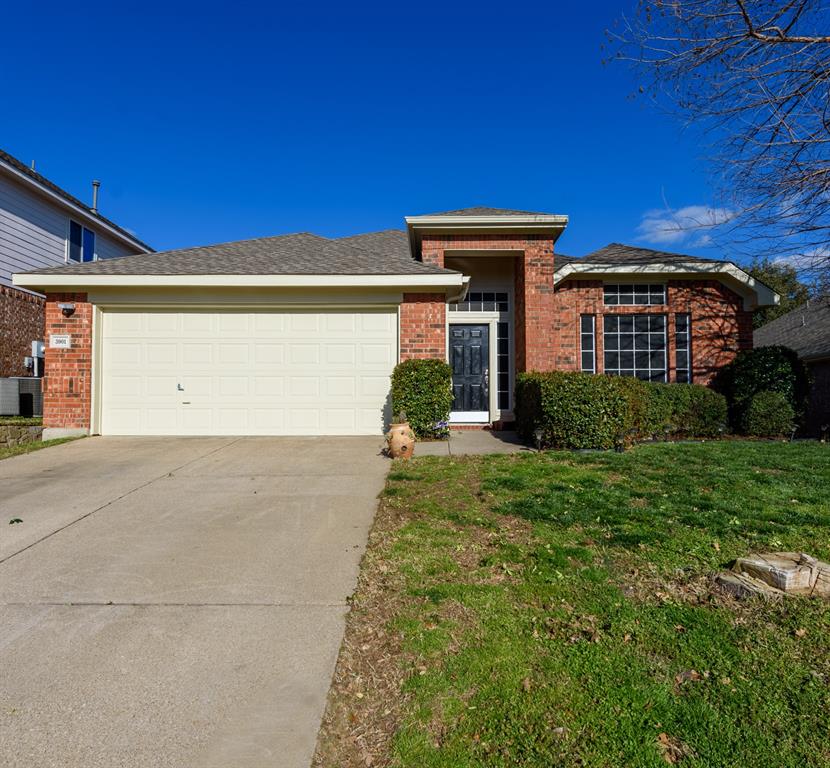3901 Centenary Drive Denton, TX 76210 - Photo 1 of 1 a front view of a house with a yard