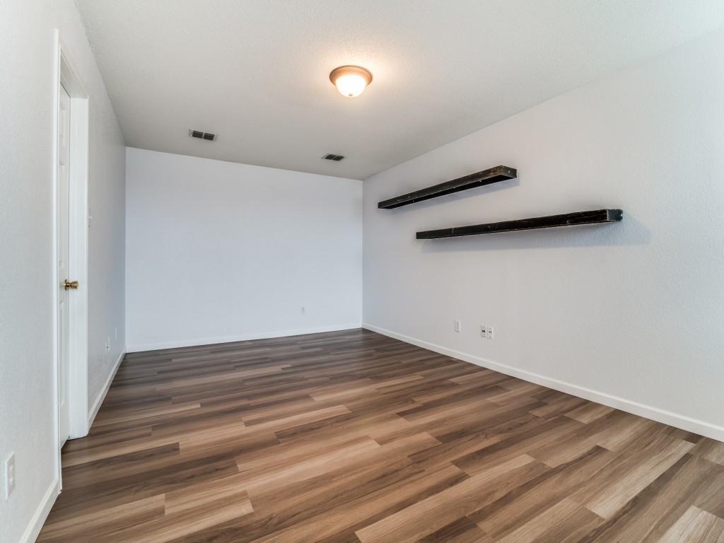 3100 Misty Ridge Lane Rockwall, TX 75032 - Photo 15 of 25 a view of an empty room with wooden floor