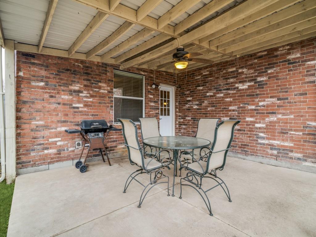 3100 Misty Ridge Lane Rockwall, TX 75032 - Photo 22 of 25 a view of a backyard with a table and chairs