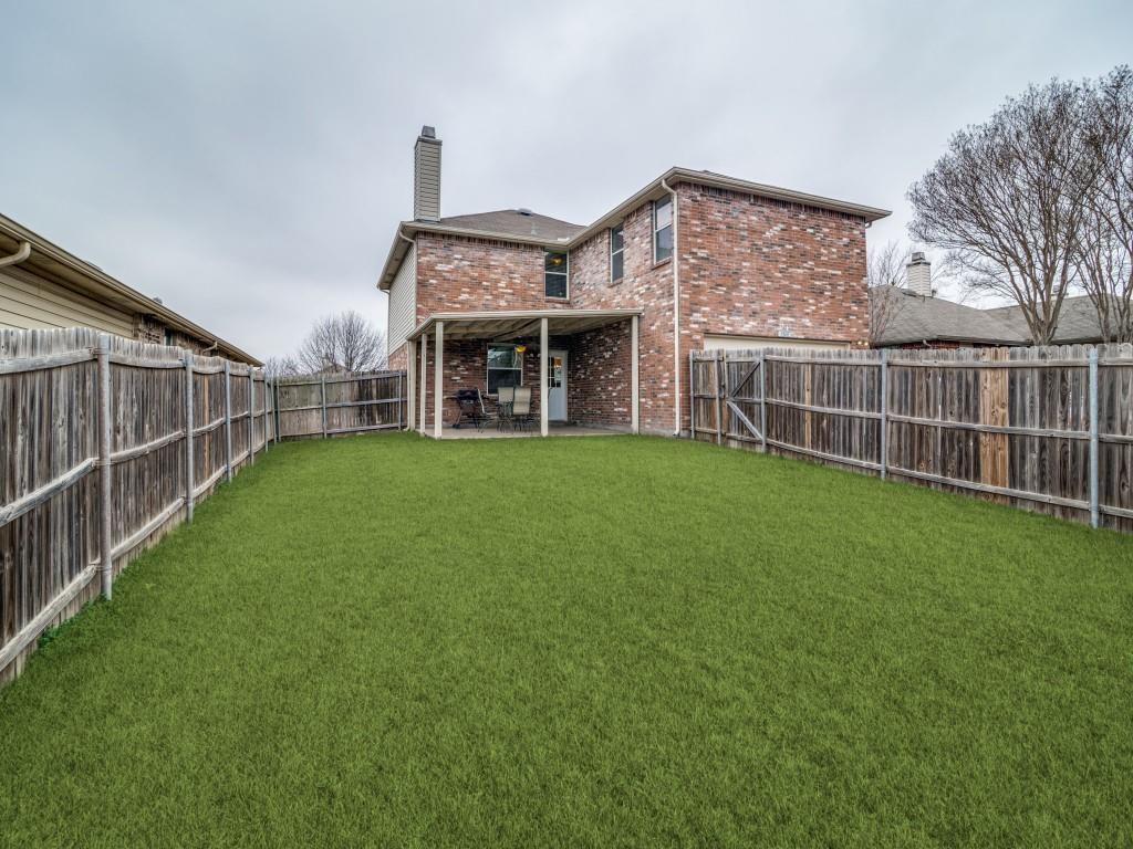 3100 Misty Ridge Lane Rockwall, TX 75032 - Photo 23 of 25 a view of a house with a yard and sitting area