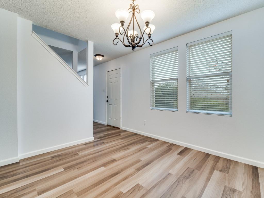 3100 Misty Ridge Lane Rockwall, TX 75032 - Photo 5 of 25 a view of empty room with wooden floor and fan