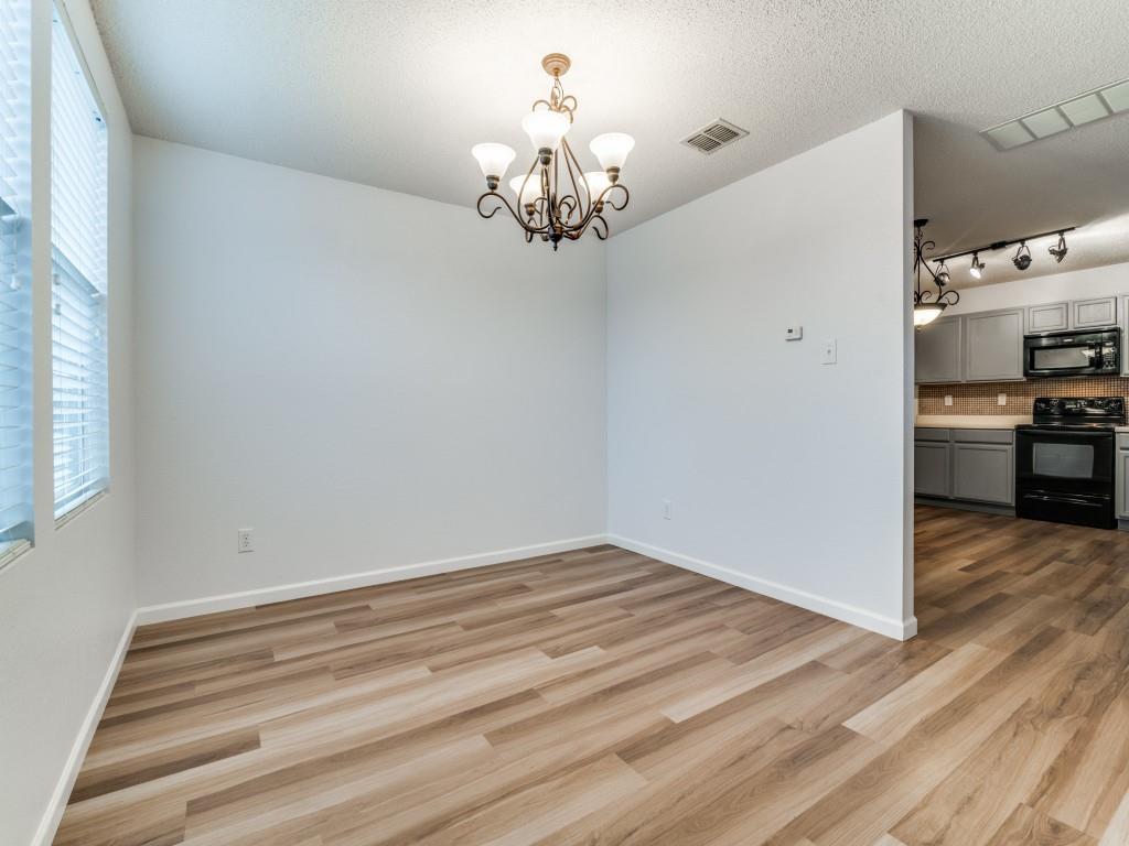 3100 Misty Ridge Lane Rockwall, TX 75032 - Photo 6 of 25 a view of a chandelier in a room