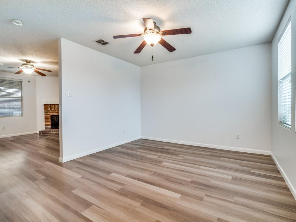 3100 Misty Ridge Lane Rockwall, TX 75032 - Photo 7 of 25 a view of empty room with wooden floor and fan
