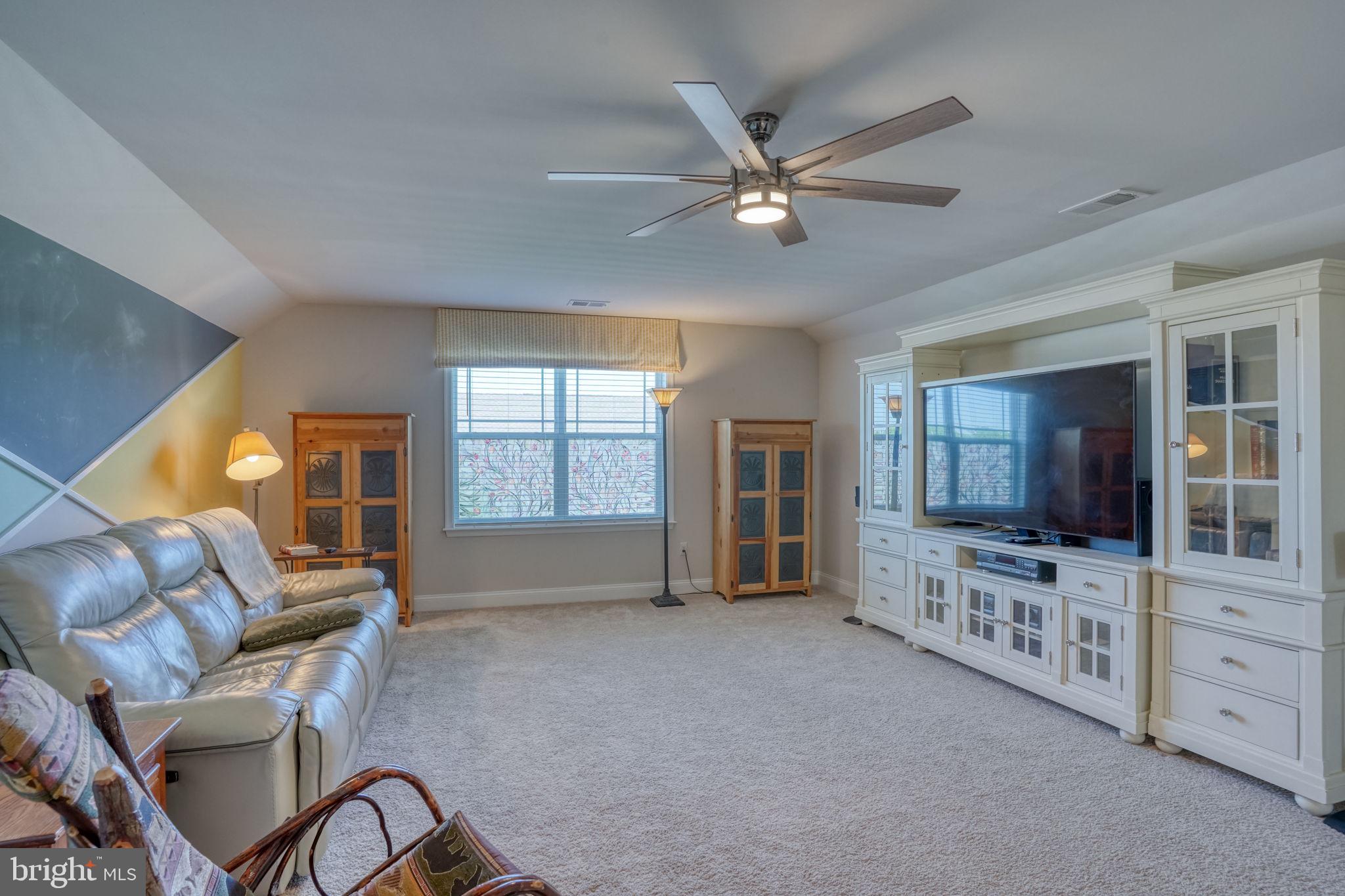 15272 Crape Myrtle Road Milton, DE 19968 - Photo 57 of 61 Spacious, light-filled living area.