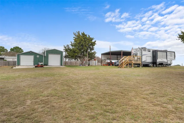 a car parked in front of white house