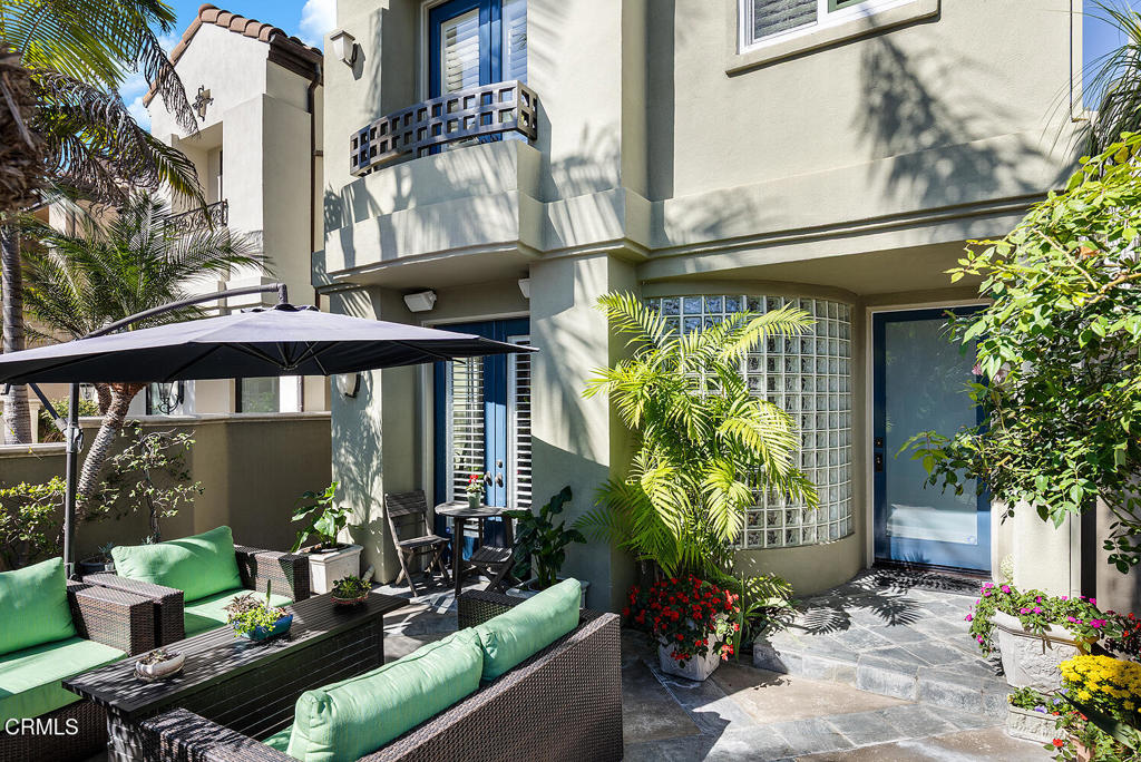 411 22nd Street Huntington Beach, CA 92648 - Photo 1 of 38 a front view of a house with outdoor seating