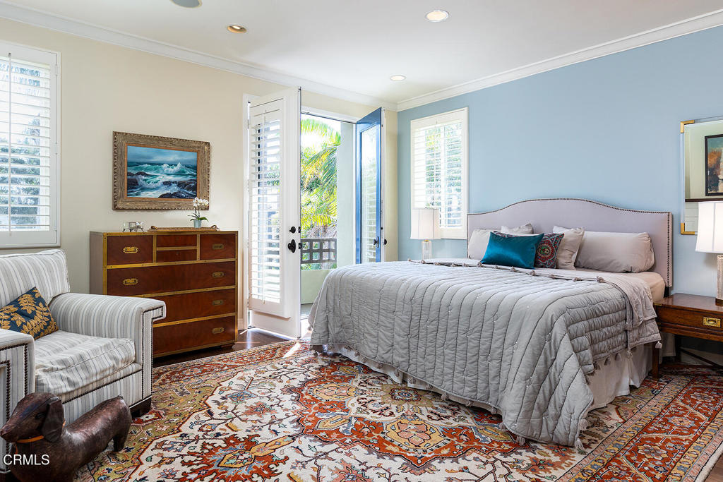 411 22nd Street Huntington Beach, CA 92648 - Photo 20 of 38 a bedroom with a bed and dresser