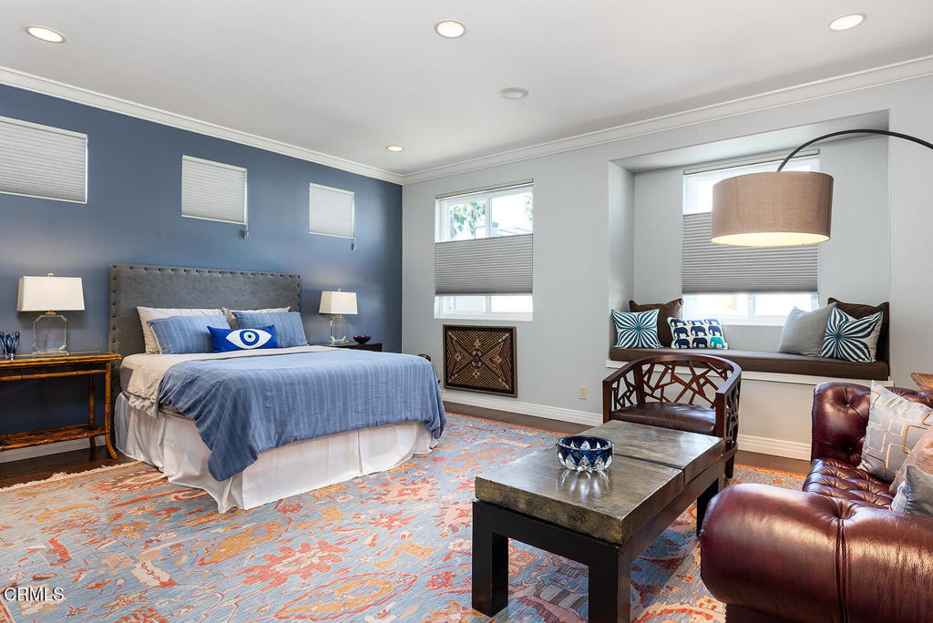 411 22nd Street Huntington Beach, CA 92648 - Photo 28 of 38 a bedroom with a bed and a couch