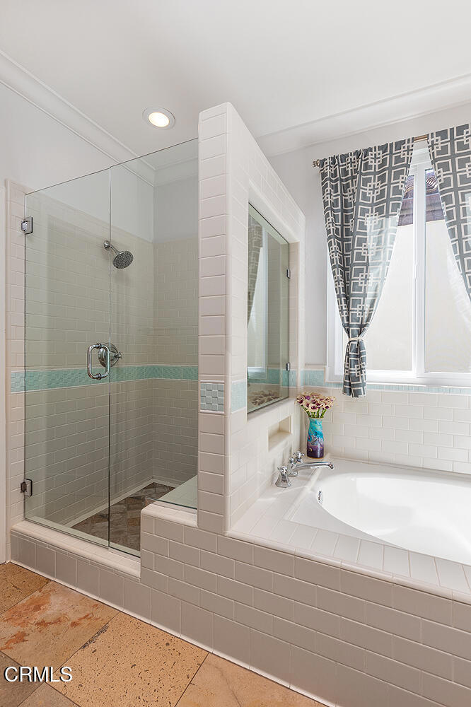 411 22nd Street Huntington Beach, CA 92648 - Photo 31 of 38 a bathroom with a granite countertop sink a mirror and shower