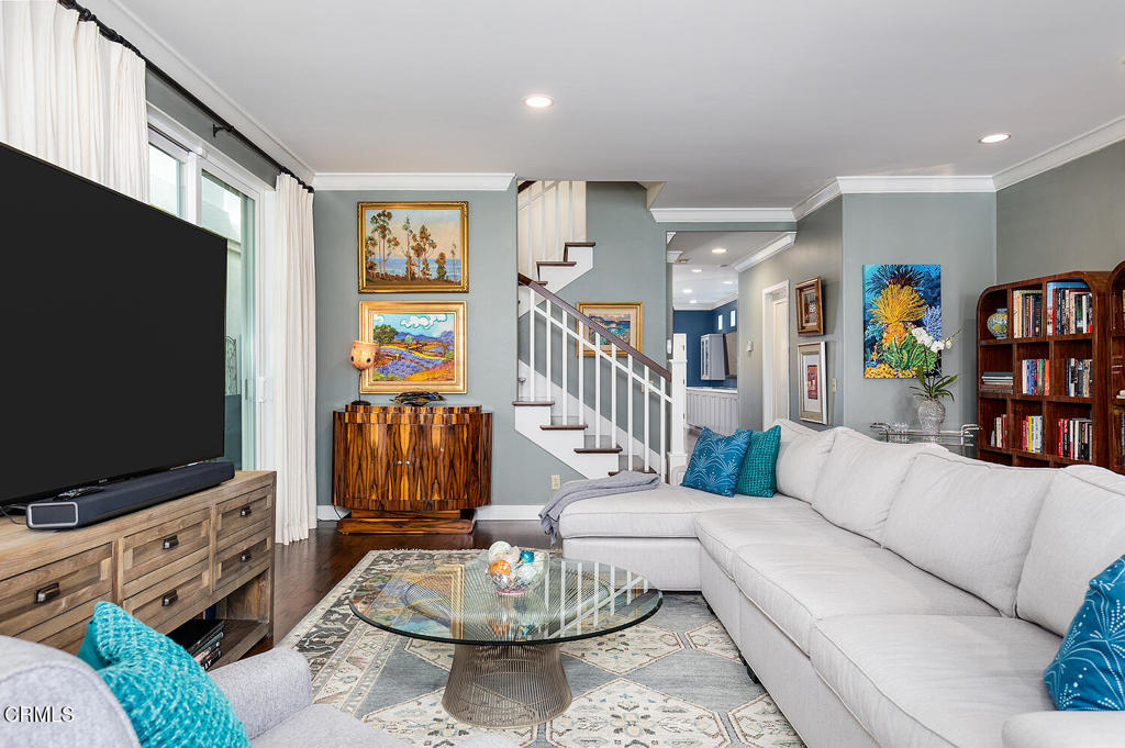 411 22nd Street Huntington Beach, CA 92648 - Photo 9 of 38 a living room with furniture and a flat screen tv