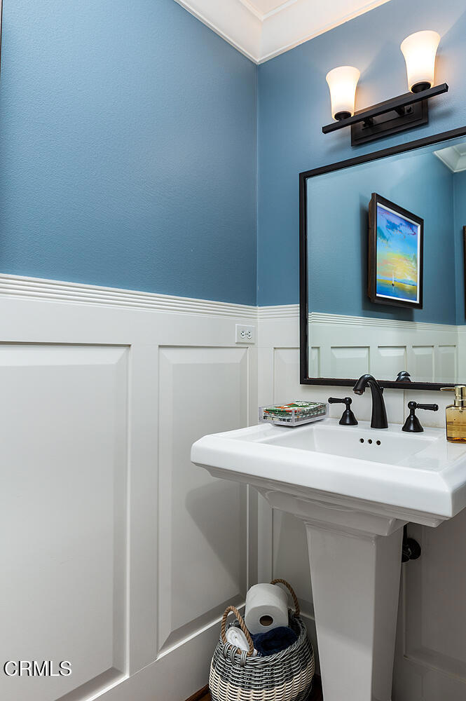 411 22nd Street Huntington Beach, CA 92648 - Photo 10 of 38 a bathroom with a sink and a mirror