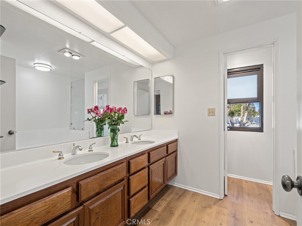 8180 Manitoba Street, Unit 302 Playa del Rey, CA 90293 - Photo 13 of 31 a bathroom with a double vanity sink and a mirror