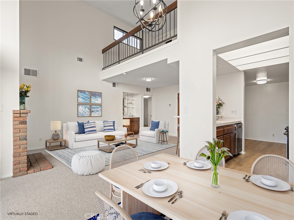8180 Manitoba Street, Unit 302 Playa del Rey, CA 90293 - Photo 2 of 31 a living room with furniture and a table