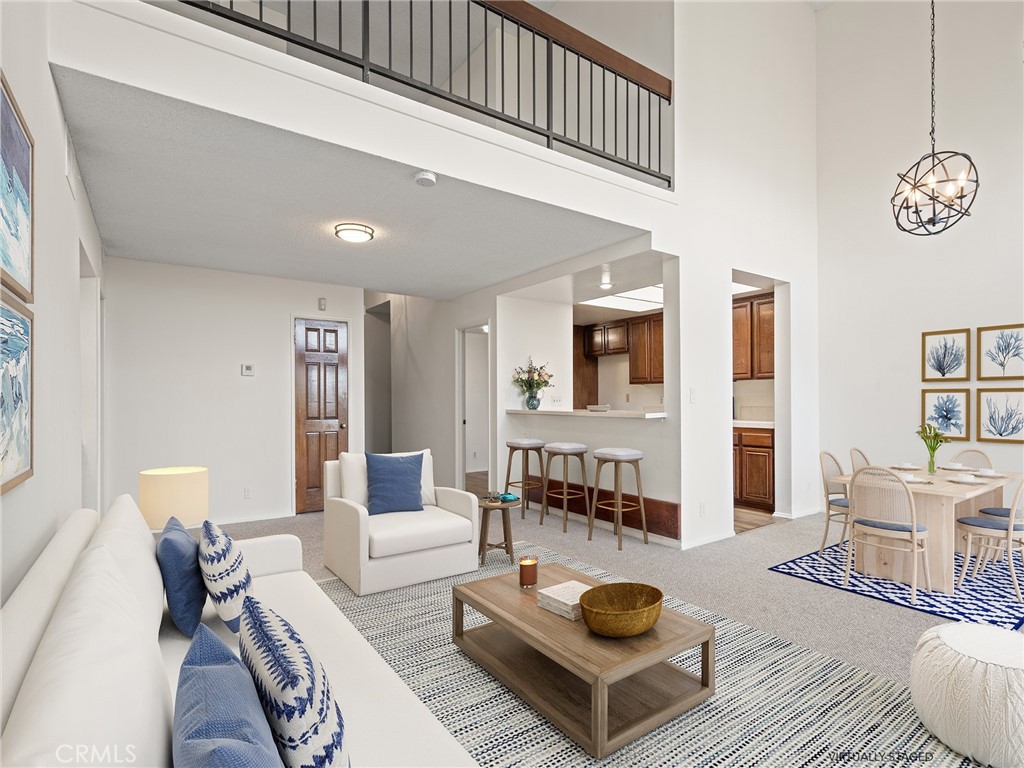 8180 Manitoba Street, Unit 302 Playa del Rey, CA 90293 - Photo 4 of 31 a living room with furniture and a table