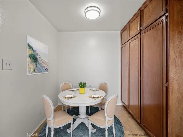 a view of a dining room with furniture and window