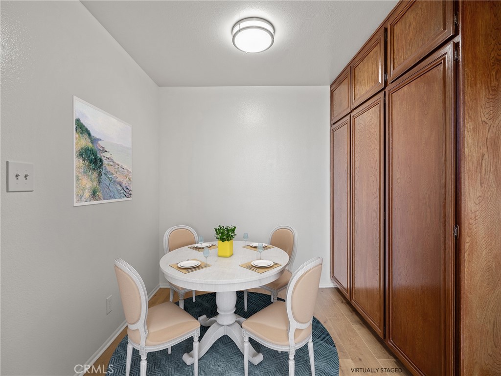 8180 Manitoba Street, Unit 302 Playa del Rey, CA 90293 - Photo 7 of 31 a view of a dining room with furniture and window