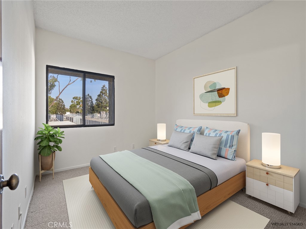 8180 Manitoba Street, Unit 302 Playa del Rey, CA 90293 - Photo 9 of 31 a bedroom with a bed and painting on the wall