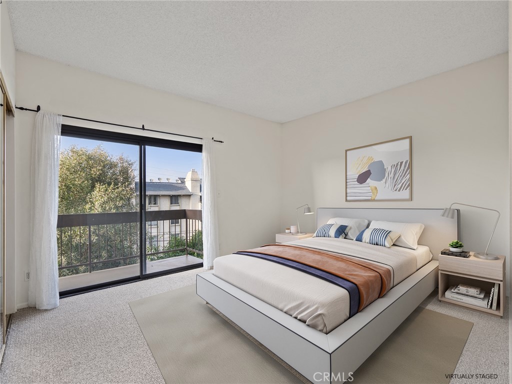 8180 Manitoba Street, Unit 302 Playa del Rey, CA 90293 - Photo 10 of 31 a bedroom with a bed lamp and window