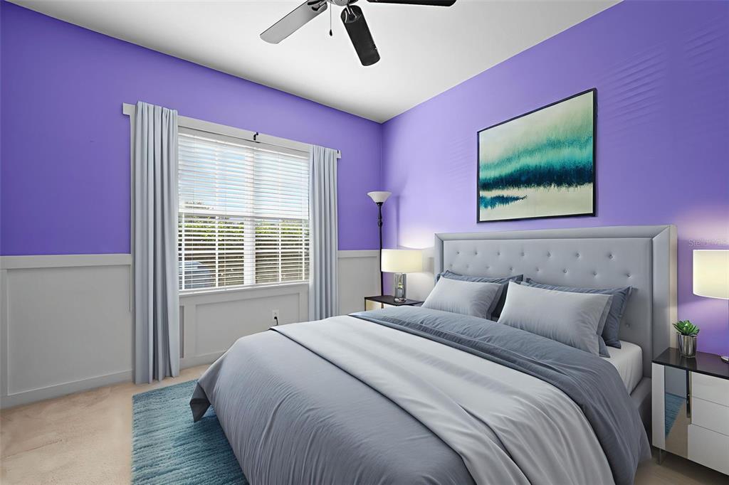 632 Winthrop Drive Spring Hill, FL 34609 - Photo 28 of 49 a bedroom with a bed and a flat screen tv