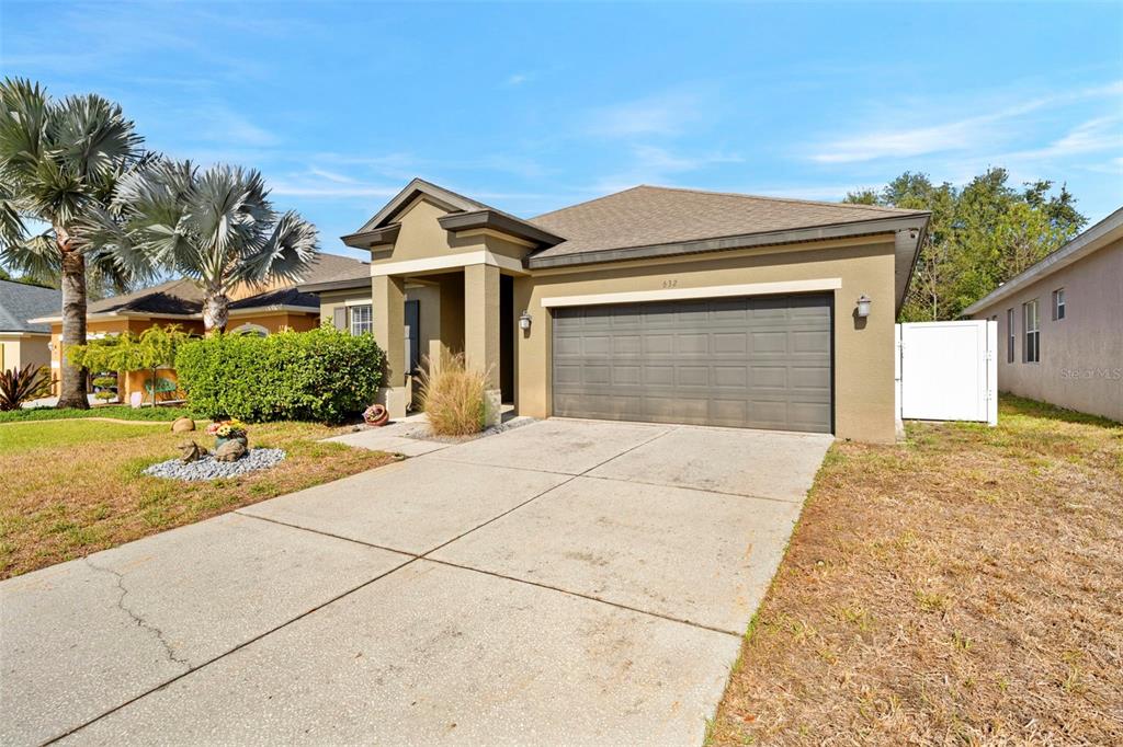632 Winthrop Drive Spring Hill, FL 34609 - Photo 5 of 49 a view of yellow house with a outdoor space
