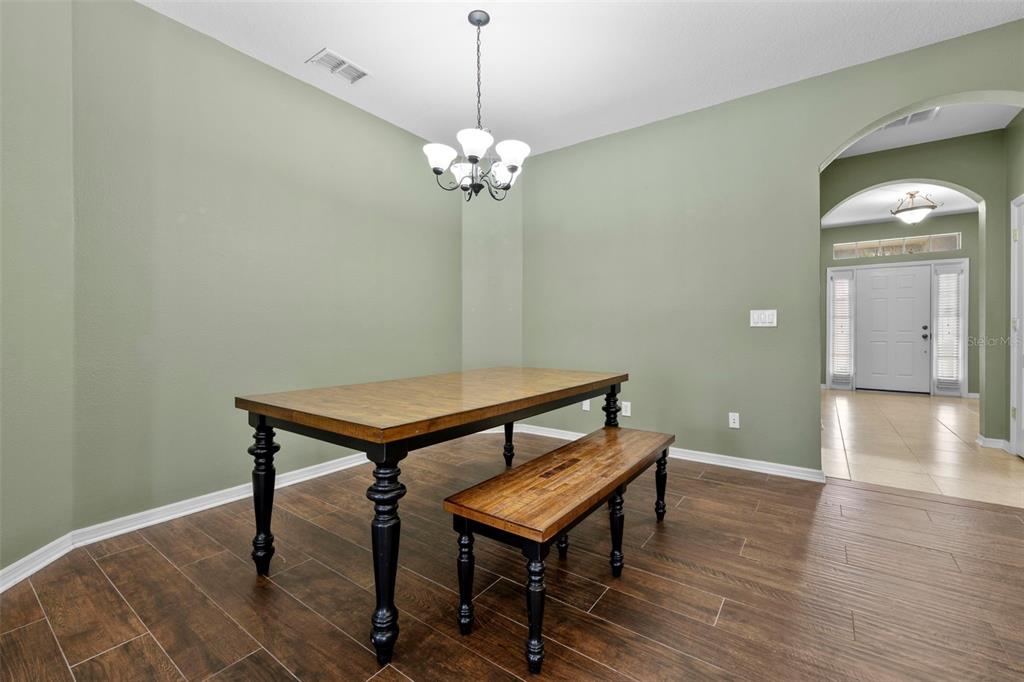 632 Winthrop Drive Spring Hill, FL 34609 - Photo 8 of 49 a view of a room with wooden floor and pool table