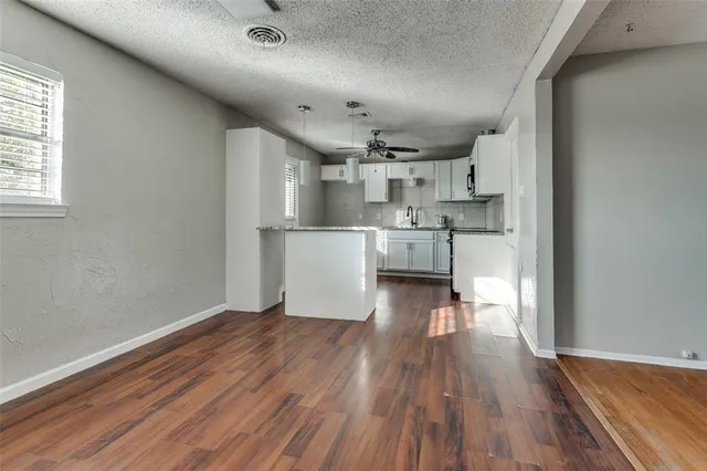 a view of kitchen and wooden floor