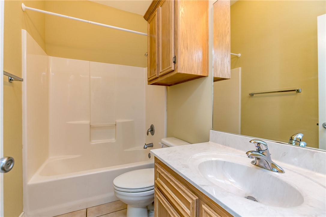 8209 Tango Circle Corpus Christi, TX 78414 - Photo 12 of 28 a bathroom with a sink a toilet and shower