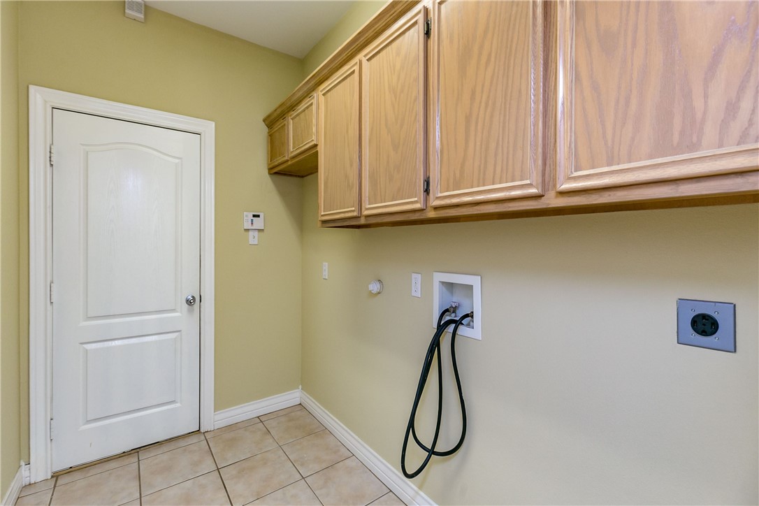 8209 Tango Circle Corpus Christi, TX 78414 - Photo 13 of 28 a bathroom with a sink a mirror and a shower