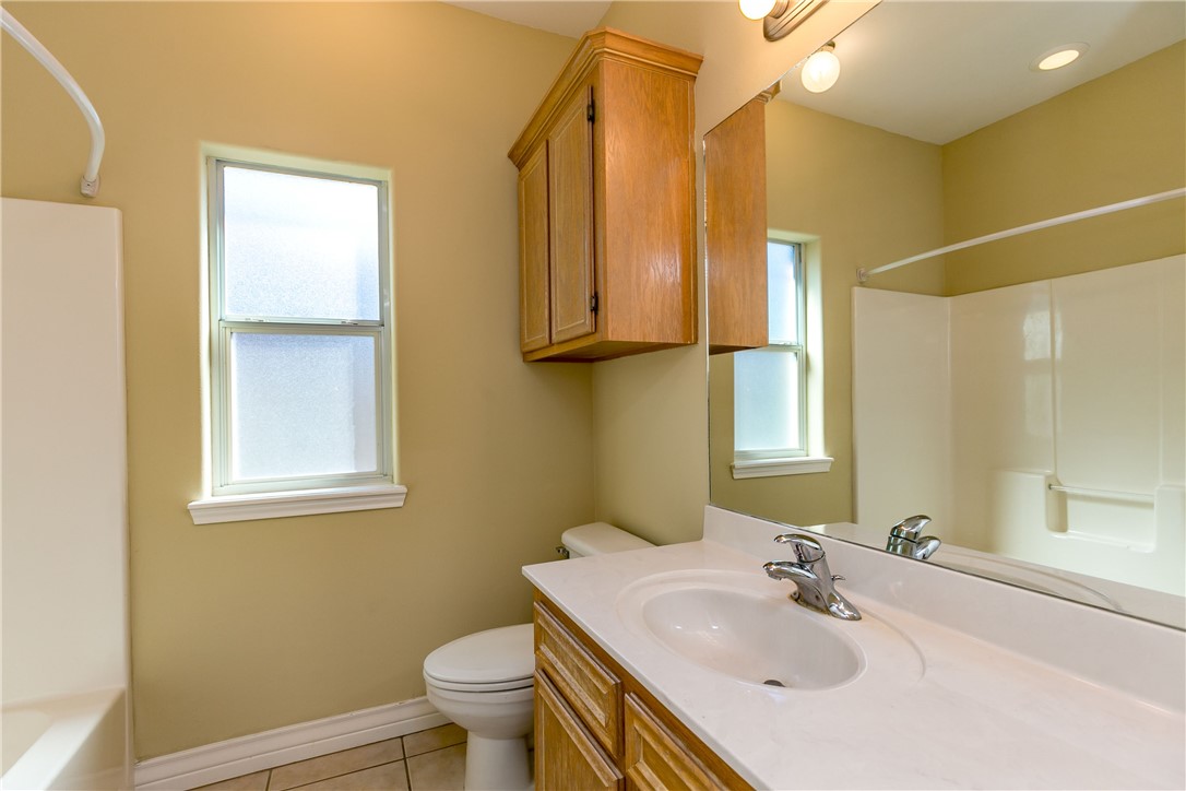 8209 Tango Circle Corpus Christi, TX 78414 - Photo 16 of 28 a bathroom with a sink toilet and mirror