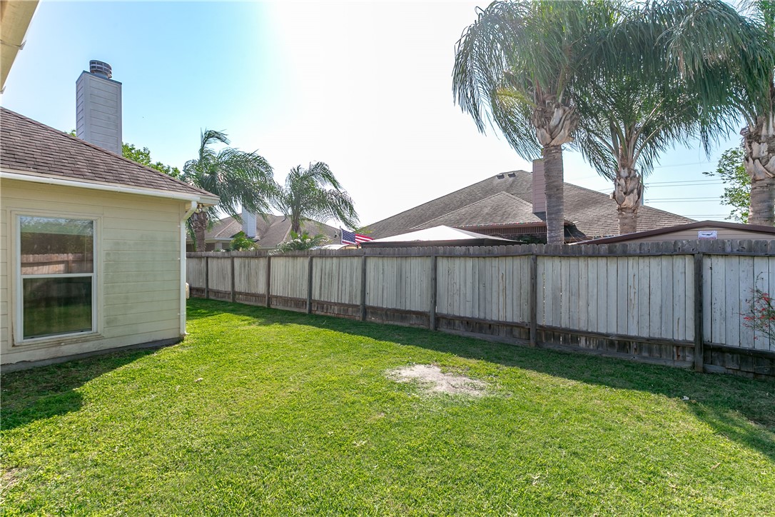 8209 Tango Circle Corpus Christi, TX 78414 - Photo 25 of 28 a view of a backyard with a tub and wooden fence
