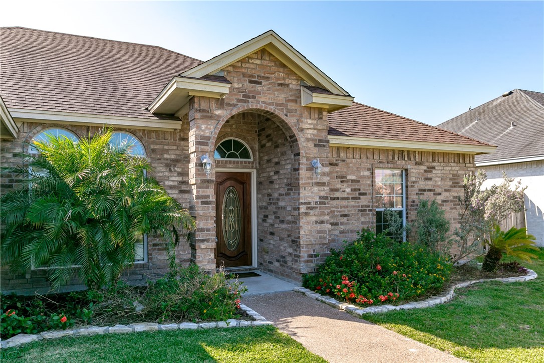 8209 Tango Circle Corpus Christi, TX 78414 - Photo 27 of 28 a front view of a house with garden