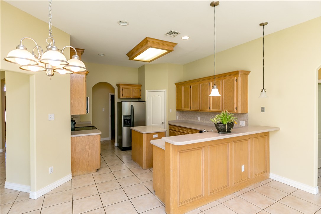 8209 Tango Circle Corpus Christi, TX 78414 - Photo 4 of 28 a room with chandelier fan and furniture