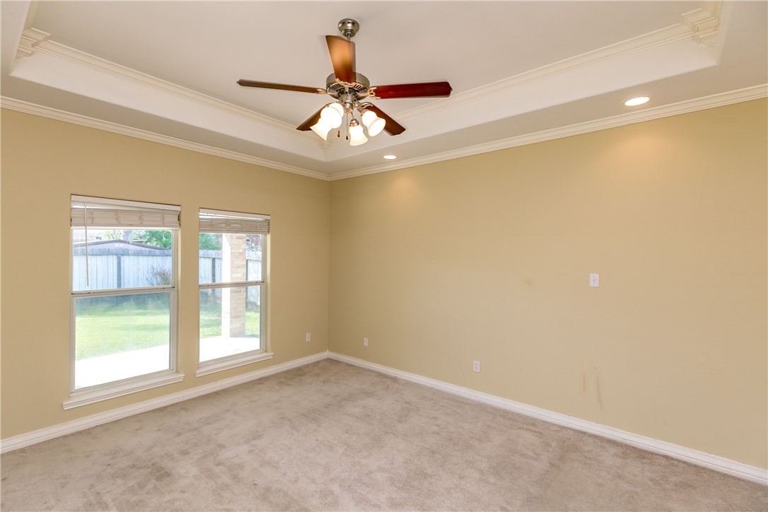 8209 Tango Circle Corpus Christi, TX 78414 - Photo 6 of 28 an empty room with windows and fan