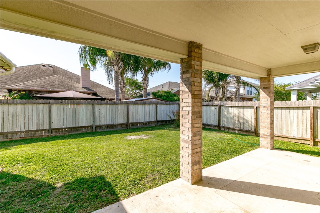 8209 Tango Circle Corpus Christi, TX 78414 - Photo 9 of 28 a view of a backyard with plants and a garden