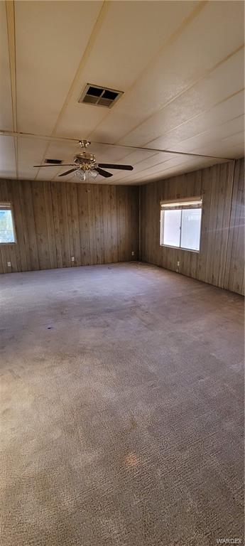 5642 Rocky Road Fort Mohave, AZ 86426 - Photo 22 of 27 a view of an empty room with a fireplace and a window