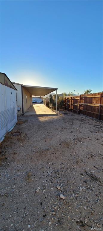 5642 Rocky Road Fort Mohave, AZ 86426 - Photo 27 of 27 a view of a dry yard with wooden fence