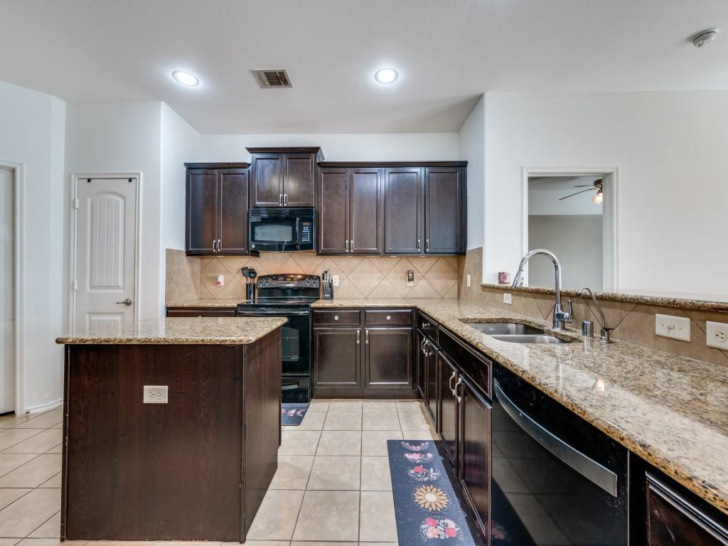 2313 Luscombe Lane Anna, TX 75409 - Photo 11 of 30 a kitchen with granite countertop a sink stove and cabinets