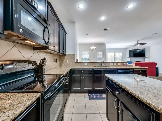 a kitchen with a stove and a microwave