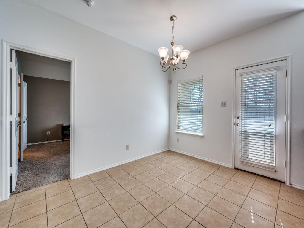 2313 Luscombe Lane Anna, TX 75409 - Photo 15 of 30 an empty room with chandelier and windows