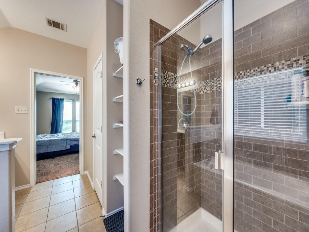 2313 Luscombe Lane Anna, TX 75409 - Photo 19 of 30 a bathroom with a glass shower door