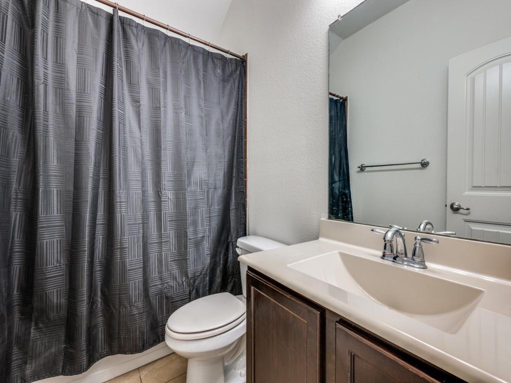 2313 Luscombe Lane Anna, TX 75409 - Photo 22 of 30 a bathroom with a granite countertop sink and a toilet