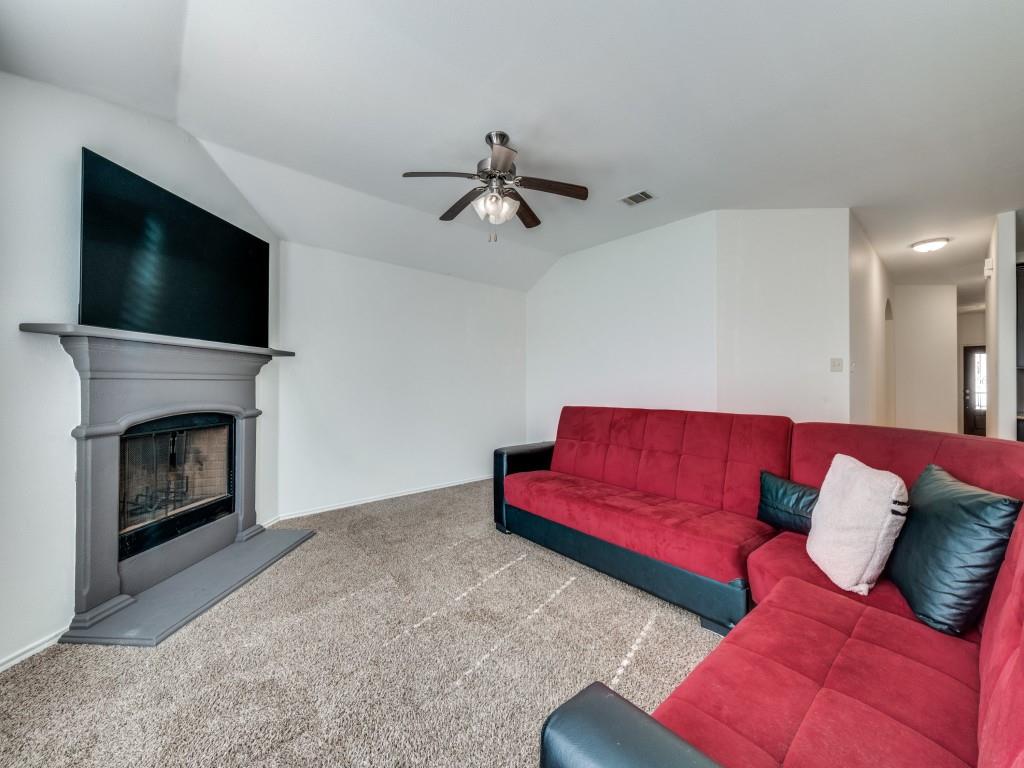 2313 Luscombe Lane Anna, TX 75409 - Photo 3 of 30 a living room with furniture or flat screen tv and a fireplace