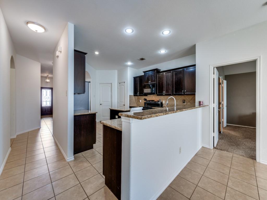2313 Luscombe Lane Anna, TX 75409 - Photo 7 of 30 a kitchen with stainless steel appliances granite countertop a refrigerator and a sink
